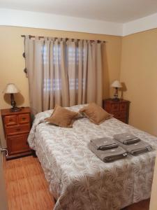 מיטה או מיטות בחדר ב-Villa Lainez