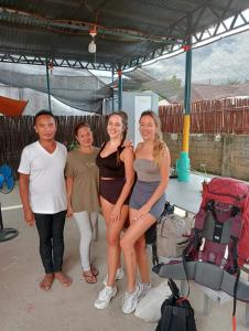 a group of people posing for a picture at Footprints Hostel in Coron