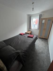 Postel nebo postele na pokoji v ubytování Goodwin Apartments