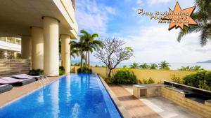 a swimming pool in the backyard of a house at The Sea Luxury Nha Trang Apartment in Nha Trang