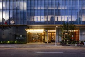 an external view of a building at night at JW Marriott Dallas Arts District in Dallas