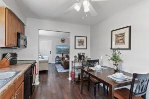 a kitchen and living room with a table and a dining room at Tranquil 2BR Apt Mpls - 8073 Apt 1 in Spring Lake Park