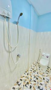 a bathroom with a shower and a toilet in a room at Koh Rong 71 Guesthouse in Koh Rong Island
