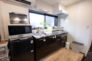 Cucina o angolo cottura di 恐竜博物館まで車で5分 自然体験 古来農業体験ができる一棟貸し宿Dinosaur Agri