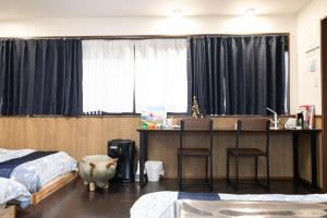 Letto o letti in una camera di 恐竜博物館まで車で5分 自然体験 古来農業体験ができる一棟貸し宿Dinosaur Agri