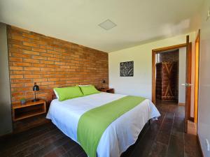 Cama o camas de una habitación en El Chasqui Guest House
