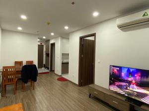 a living room with a flat screen tv on a wall at FPT Plaza 2 in Danang