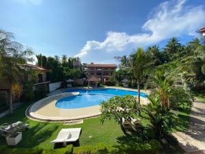 an image of a swimming pool at a resort at Sierra Resort in Dauin