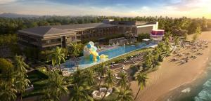ein Luftblick auf ein Resort mit Pool und Strand in der Unterkunft Roxy Beach Apartment in Sematan