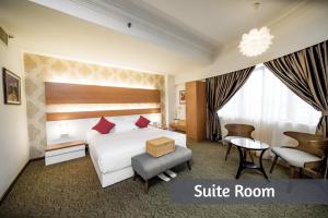 Postel nebo postele na pokoji v ubytování MITC Hotel