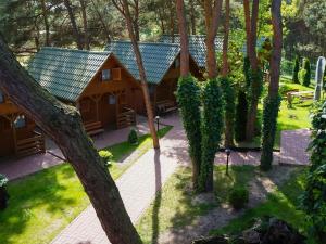 an aerial view of a house in the woods at Cozy holiday cottages close to the beach, azy in Łazy