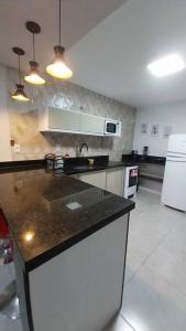 Dapur atau dapur kecil di Casa de Temporada no Paraíso de Arraial do Cabo