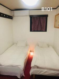 Postel nebo postele na pokoji v ubytování 冠京ホテル