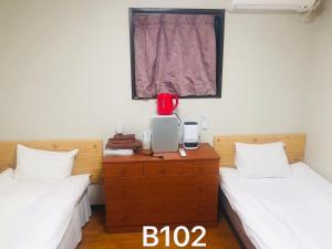 Postel nebo postele na pokoji v ubytování 冠京ホテル