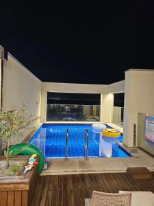 a large swimming pool in a house at Miracle Suite house 201 pool villa in Incheon