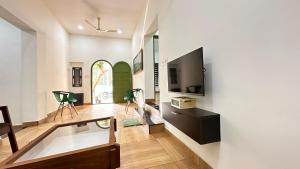 A television and/or entertainment centre at Better Inn AC Villa Kovalam
