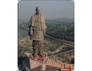 a statue of a man standing on top of a building at Hotel Narmada, Kevadia, Narmada in Lāchharas