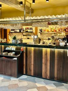 a kitchen with a bar with a counter top at Aparthotel in Chişinău