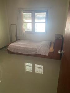 Postel nebo postele na pokoji v ubytování Grace Little Home chiangmai