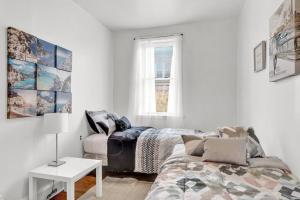 a living room with a bed and a couch at Cozy 2br Near Bella Vista Philly By Center City in Philadelphia