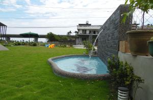 Bazén v ubytování Footprint Garden B&B nebo v jeho okolí