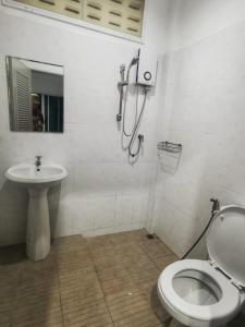 a bathroom with a shower and a toilet and a sink at AA Apartment in Koh Samui 