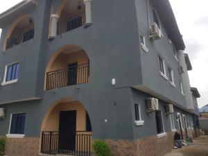 un bâtiment bleu avec des arches et des fenêtres. dans l'établissement 3JD Lavishly Furnished 1-Bed Apt, à Lagos