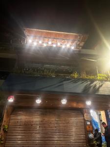 a building with lights on top of it at night at One House in Gongliao