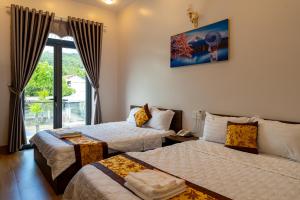 Een bed of bedden in een kamer bij Hotel Mỹ Vy