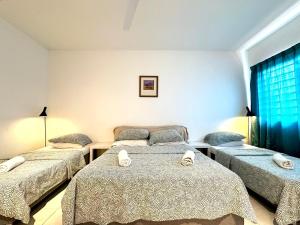Giường trong phòng chung tại BNB Cozy Homestay - Emerald West Rawang