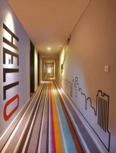 a bowling alley with a rainbow on the wall at Cabin Hotel in Jakarta