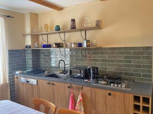 a kitchen with a sink and a counter top at Snowpeak Chalet Gudauri in Gudauri