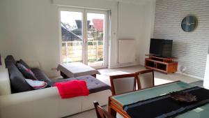 Posezení v ubytování Appartement les mirabelles entre Strasbourg et Haguenau