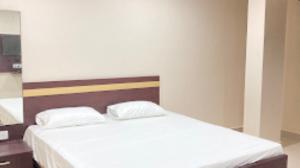 Lova arba lovos apgyvendinimo įstaigoje Hotel City View Bhubaneswar