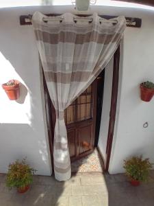 a doorway with a curtain in front of a door at Cueva La Ermita II in Guadix