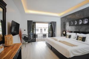 Postel nebo postele na pokoji v ubytování ETK Patong Resort + 37 fotografií