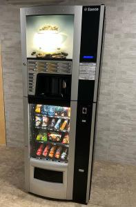 a vending machine with food and drinks in it at Motel Zeta Lux in Mitrovići