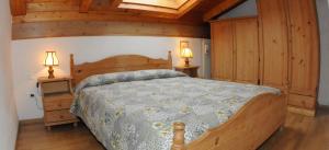 Ένα ή περισσότερα κρεβάτια σε δωμάτιο στο Casa Canazei +8 φωτογραφίες