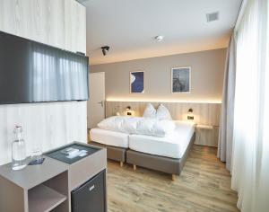 Postel nebo postele na pokoji v ubytování Hotel Balga Natur- und Bikehotel