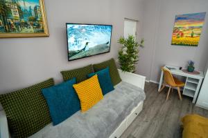 a living room with a couch and a table at Chic Studio Old City Center - IVO19 in Bucharest