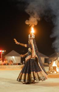 a person in a pyramid costume with smoke coming out at Tripli Hotels Stay Inn Resort Jaisalmer in Sām