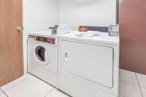 a washer and dryer in a room at Super 8 by Wyndham Kenosha/Pleasant Prairie in Pleasant Prairie