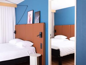Postel nebo postele na pokoji v ubytování ibis Valenciennes