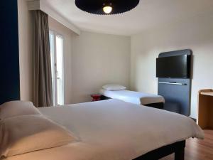 Postel nebo postele na pokoji v ubytování ibis Valenciennes
