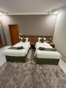 Voodi või voodid majutusasutuse Muscat Hills Hotel toas