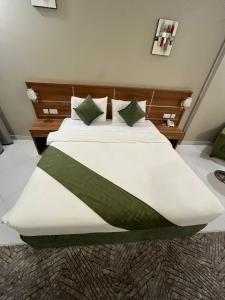 Voodi või voodid majutusasutuse Muscat Hills Hotel toas