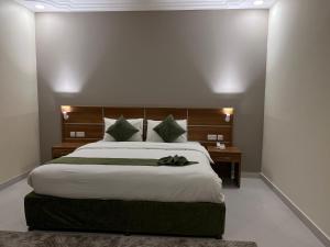 Voodi või voodid majutusasutuse Muscat Hills Hotel toas