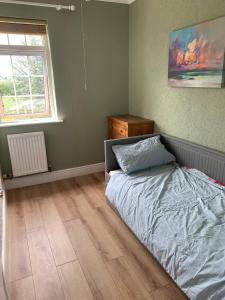 a bedroom with a bed and a window at Wellbet Farm in Lincoln