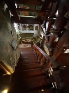 an overhead view of a staircase in a living room at Pensiunea Andrei in Borşa