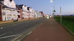 an empty street with houses on the side of the road at Seaside 2 bed flat sleeps 6 in Lee-on-the-Solent
